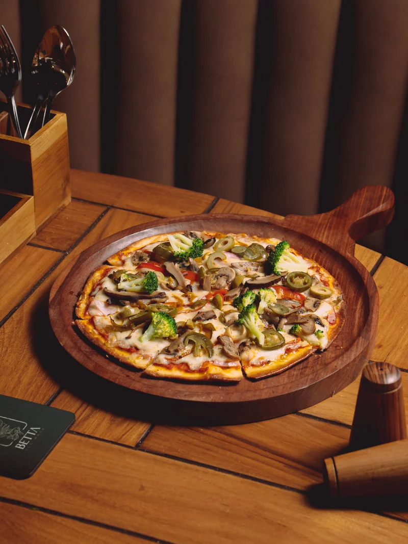 Vegetarian pizza with mushrooms and greens