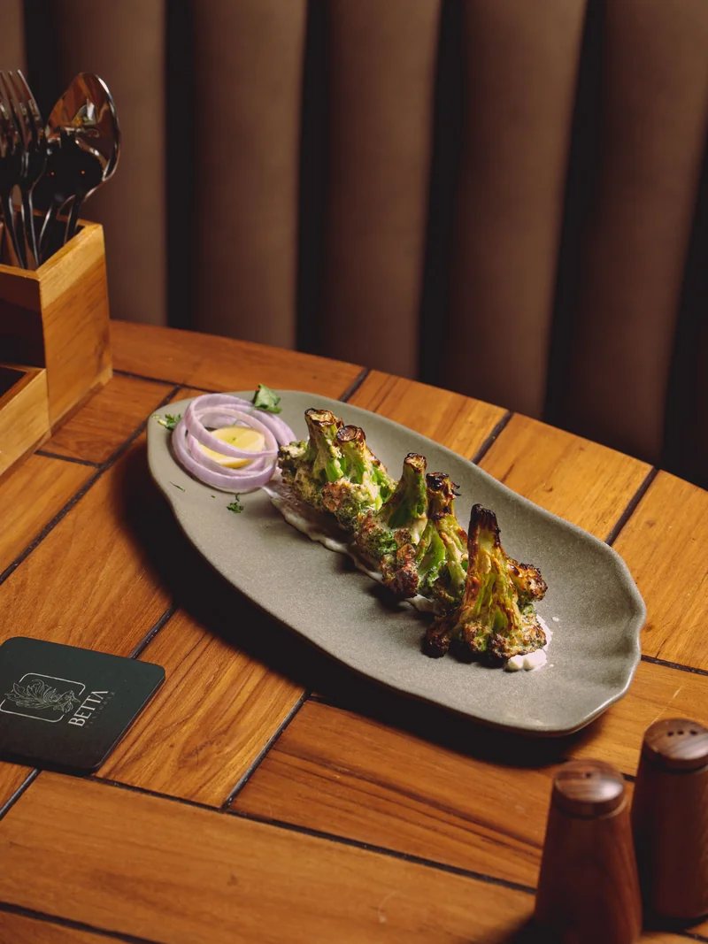 Grilled broccoli with onion and sauce