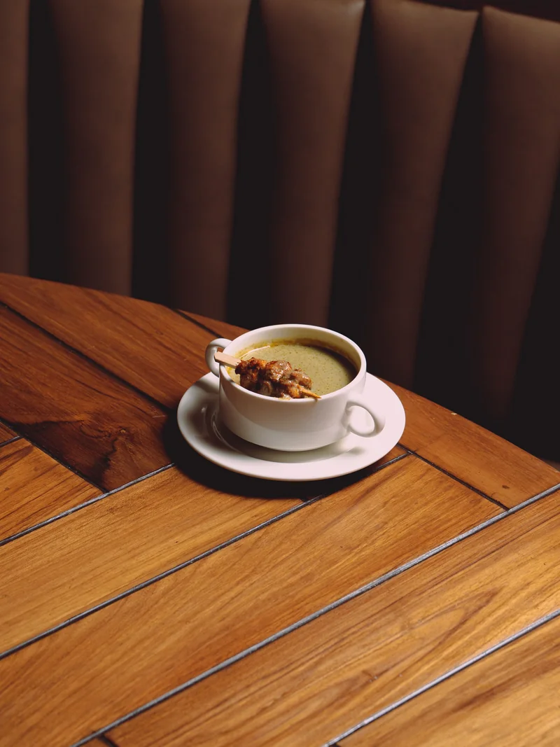Creamy soup in elegant white bowl