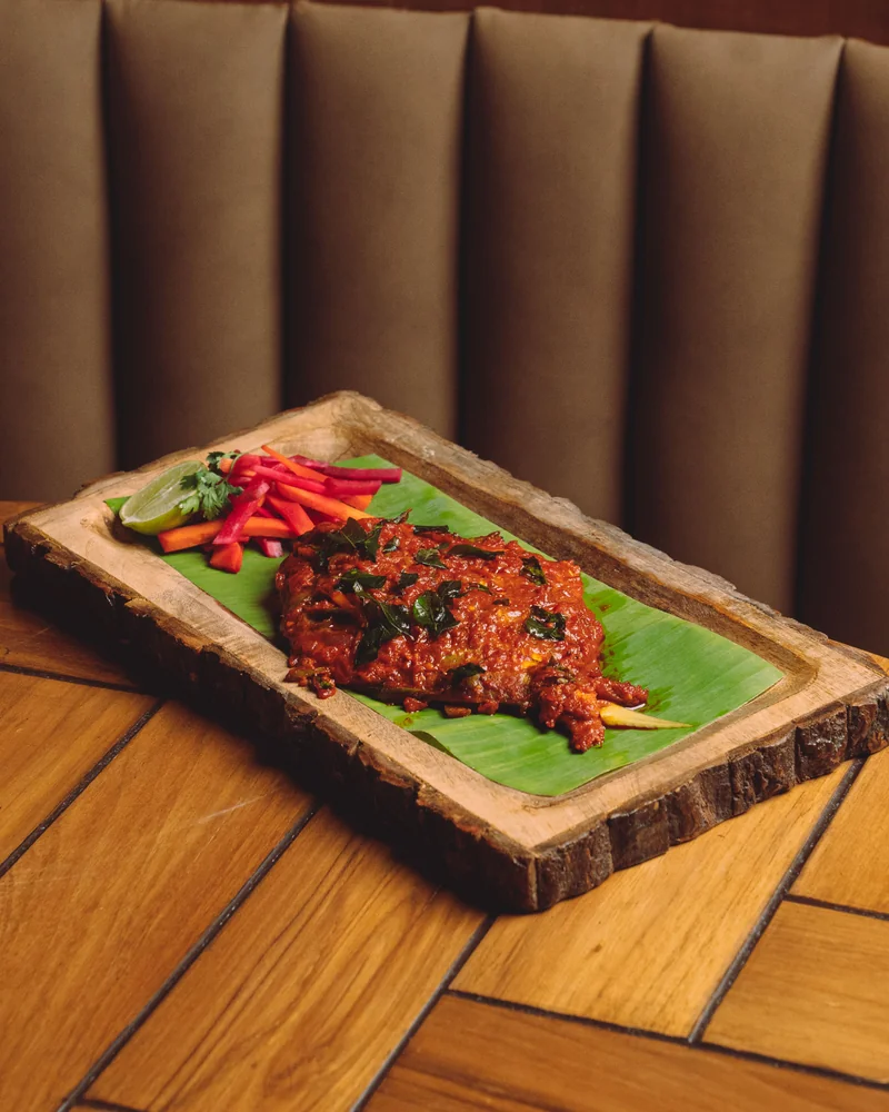 Crispy meat with peppers on wooden board